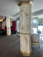 Gold and cream marble effect pillars. photo - Set-Exchange.co.uk