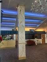 Gold and cream marble effect pillars. image 2