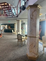 Gold and cream marble effect pillars. image 3
